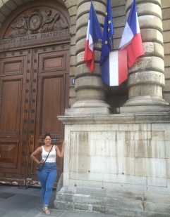 Tiffany Mateo standing in front of the French Senate building. 